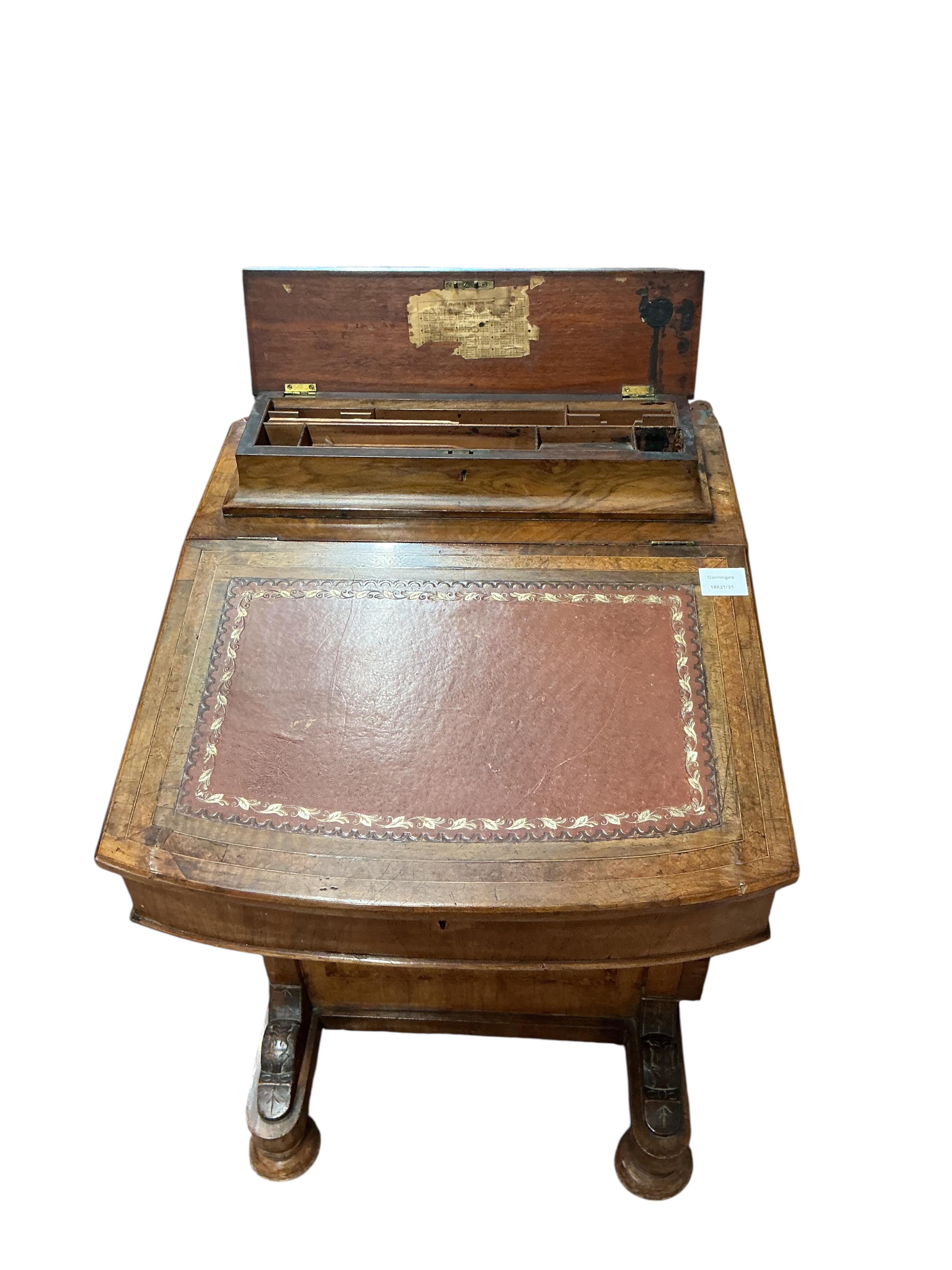 A late Victorian banded walnut Davenport, width 53cm, depth 54cm, height 84cm